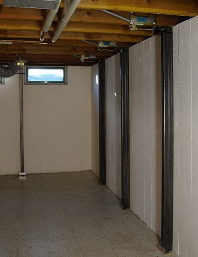 photo of Gorilla Wall Braces installed in a basement with white basement walls