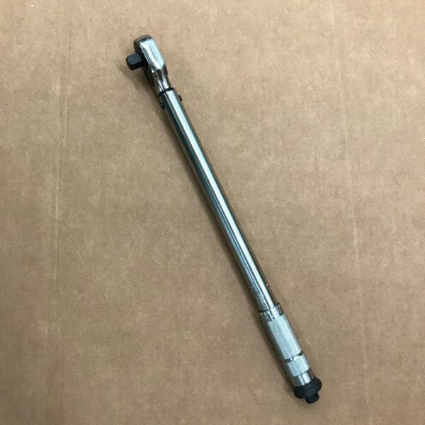 photo of the side-view of a metal torque wrench